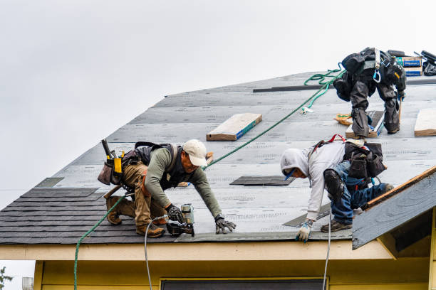Professional Roofing technician working in Mentone, IN